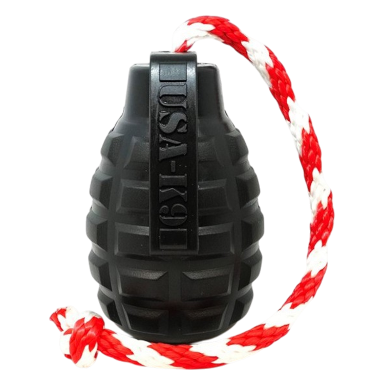The SodaPup USA-K9 Magnum Grenade is a black, grenade-shaped durable rubber chew toy, treat dispenser, and tug toy on a red and white rope—shown against a plain white background.