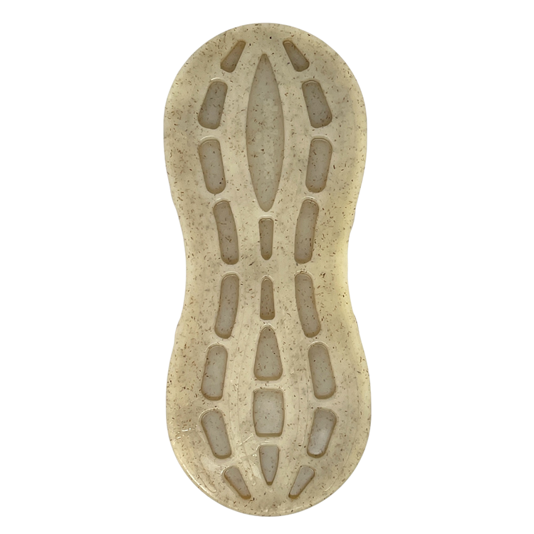 Top-down view of the SodaPup Peanut EChew Ultra Durable Nylon Dog Chew Toy, featuring a translucent beige look with an organic, pod-like tread pattern, speckled details, elongated cutouts, and a rounded form—designed to relieve dog anxiety.