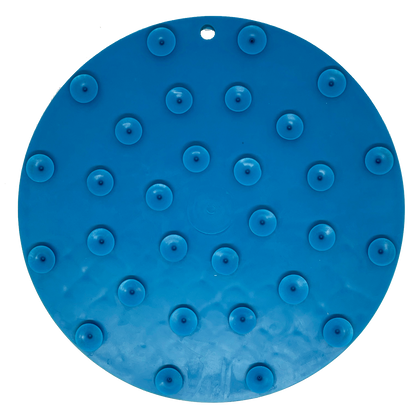 A Whale Design EMat Enrichment Lick Mat With Suction Cups from SodaPup, featuring evenly distributed suction cups on one side. The mat, an ideal pet enrichment tool, has a small hole near the edge, suggesting it can be hung when not in use.