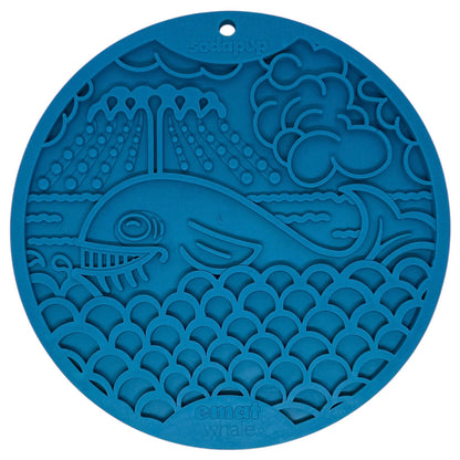 The Whale Design EMat Enrichment Lick Mat With Suction Cups by SodaPup features a blue, round silicone mat with a smiling whale and ocean scene—ideal for enrichment or bath time distractions. "SodaPup" and "emati whale" are embossed on the mat.