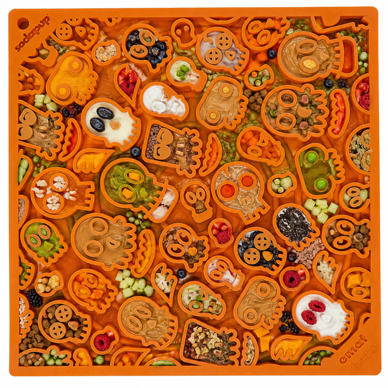 The SodaPup Zombie Design Emat Enrichment Lick Mat features skull and bone-shaped compartments for holding colorful treats, making mealtime engaging and fun for your dog.