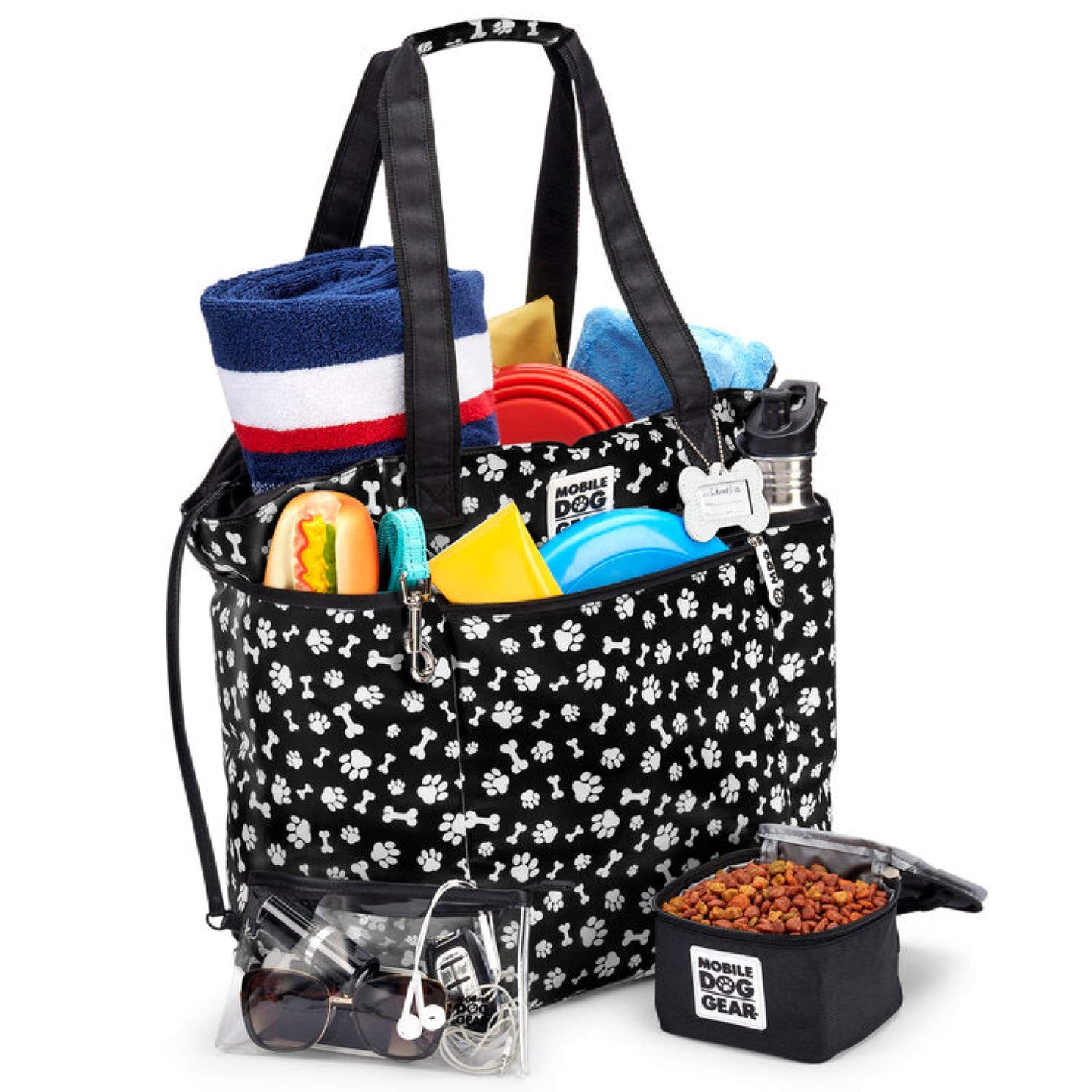 A Mobile Dog Gear travel tote containing various Dogssentials that meet airline carry-on requirements.