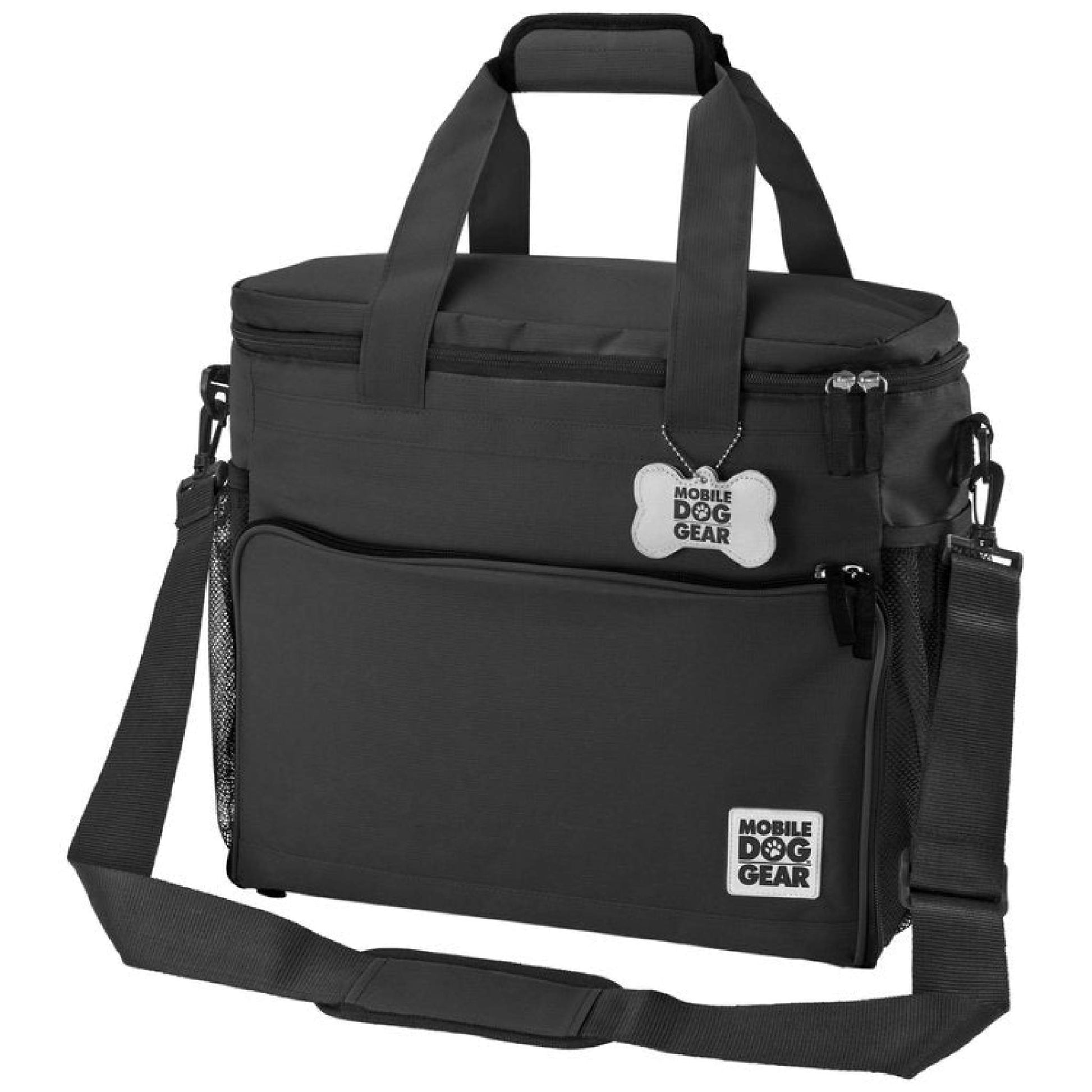 A black, soft-sided insulated dog travel bag with multiple compartments and a shoulder strap, labeled "Large Week Away® Tote Bag" by Mobile Dog Gear.