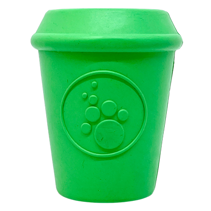 The SodaPup Coffee Cup EDispenser is a bright green, durable rubber chew toy and treat dispenser for dogs, shaped like a cup with a raised paw print on the front, shown against a plain white background.