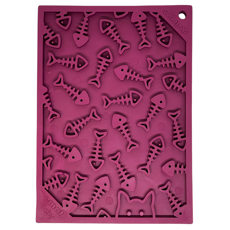 The SodaPup Fishy Design EMat Enrichment Lick Mat - Small is a purple silicone mat with raised fish, fishbone shapes, and a partial cat face outline—perfect for serving pet treats or as an engaging feeding surface.