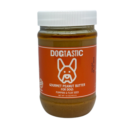 SodaPup Dogtastic Gourmet Peanut Butter for Dogs – Pumpkin & Flax Seed Flavor comes in a jar with an orange label, features a white cartoon dog face, and is made in the USA with all natural ingredients.