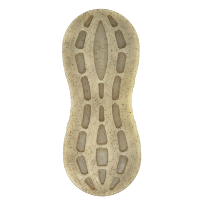 Top-down view of the SodaPup Peanut EChew Ultra Durable Nylon Dog Chew Toy, featuring a translucent beige look with an organic, pod-like tread pattern, speckled details, elongated cutouts, and a rounded form—designed to relieve dog anxiety.
