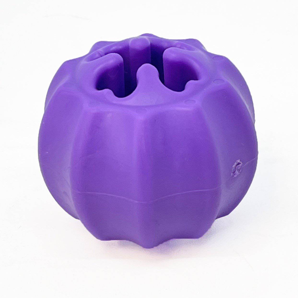 A purple Cross Bones chew toy with a hole in the middle, perfect for stuffing treats or a bully stick, made by SodaPup.