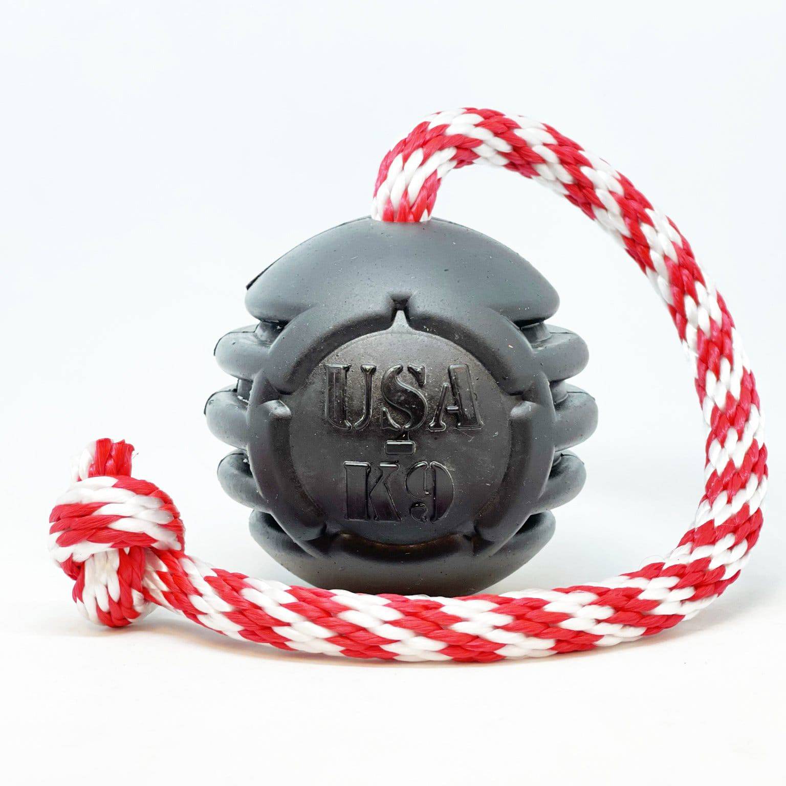 A SodaPup black and white dog toy with dental ridges and a red and white rope, designed for large dogs.