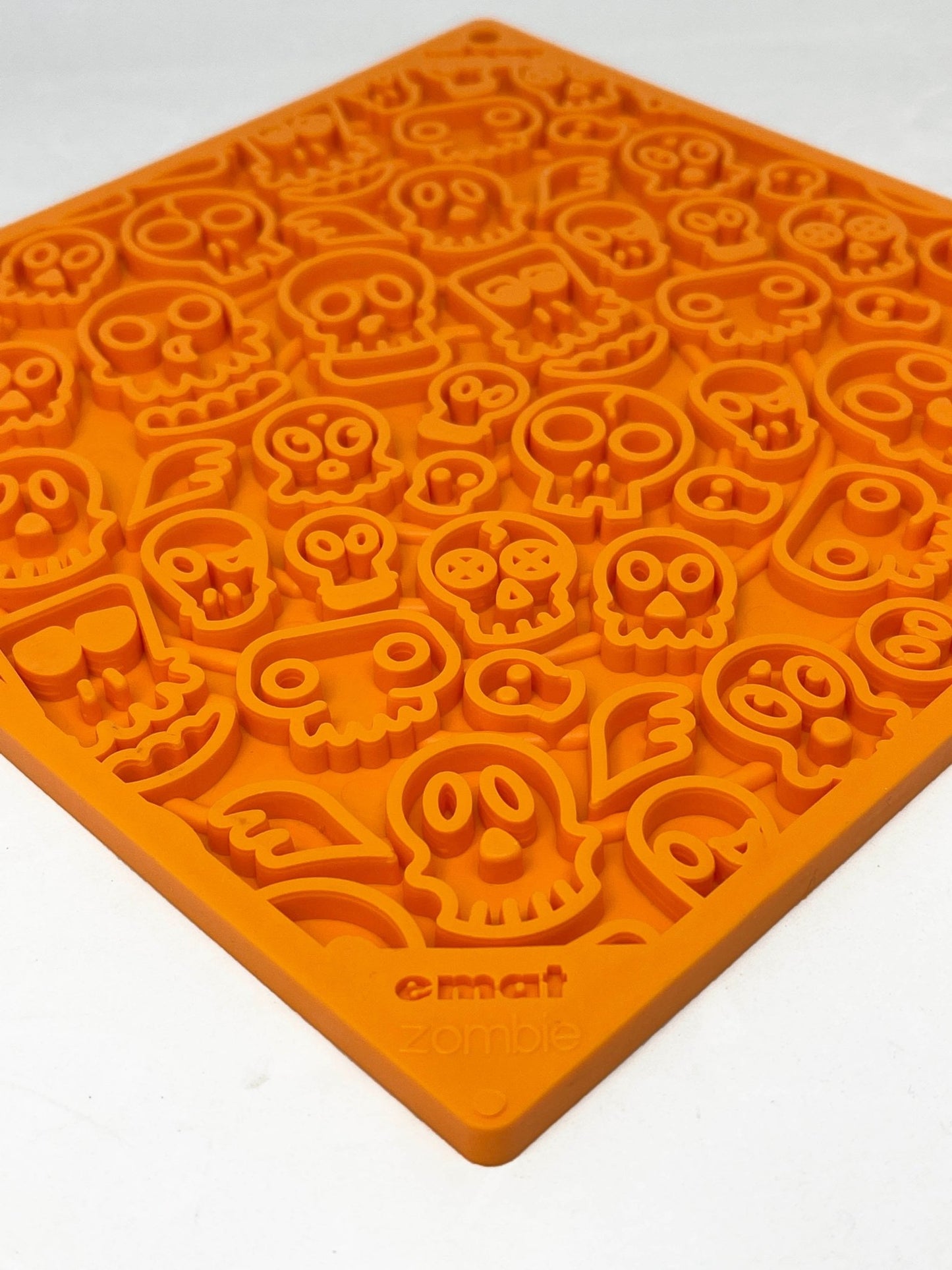 A Cookie sheet with a Zombie Design Emat Enrichment Lick Mat from SodaPup.