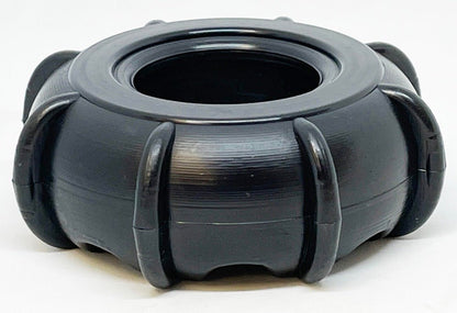 A round black planter with a glossy finish features vertically ridged sections around its circumference, giving it a sculpted appearance similar to the SodaPup ID Tractor Tire EChew Ultra Durable Nylon Chew & Enrichment Toy. The open-top design stands out against a neutral background, echoing the sleek lines of this enrichment toy.