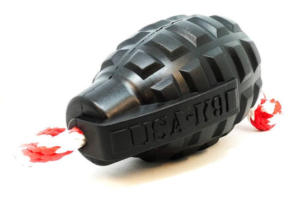 A SodaPup Magnum Grenade Durable Rubber Chew Toy with a rope attached to it for powerful chewers.