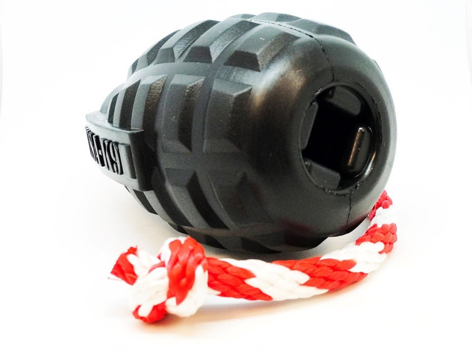 A SodaPup USA-K9 Magnum Grenade Durable Rubber Chew Toy with a rope attached to it, perfect for power chewers.