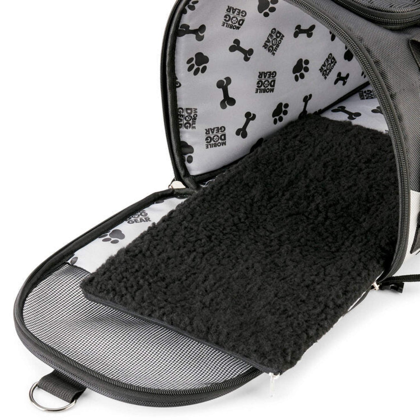 An Mobile Dog Gear Pet Carrier Plus bag with a dark gray exterior and a paw print patterned lining, featuring a comfortable black fleece bedding inside.