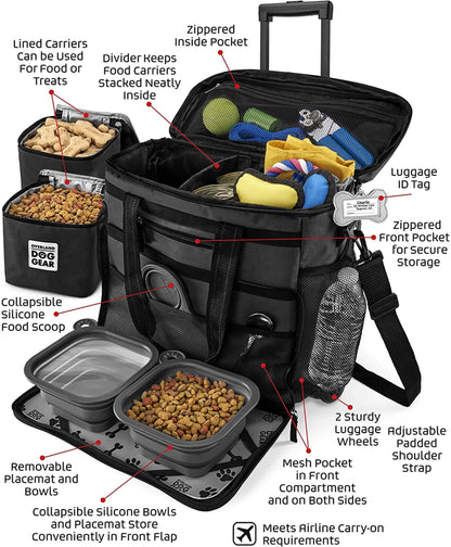 Illustration of an open, feature-packed Mobile Dog Gear Rolling Week Away Dog Travel Bag with compartments for food carriers, treats, bowls, and a scoop, plus side pockets, ID tag, and sturdy handles. Meets airline standards.