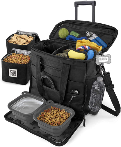 A Rolling Week Away Dog Travel Bag designed for pets opens to reveal compartments filled with dog food, toys, treats, and a water bottle. It includes an external mesh pocket and portable food containers by Mobile Dog Gear.