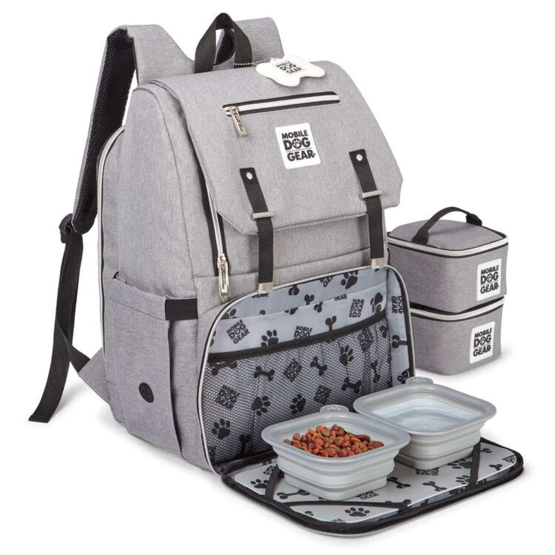 The Mobile Dog Gear Ultimate Week Away Backpack, a travel bag for dogs, includes a dog bowl and bowls in it.