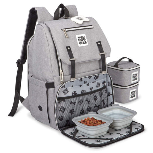 The Mobile Dog Gear Ultimate Week Away Backpack, a travel bag for dogs, includes a dog bowl and bowls in it.