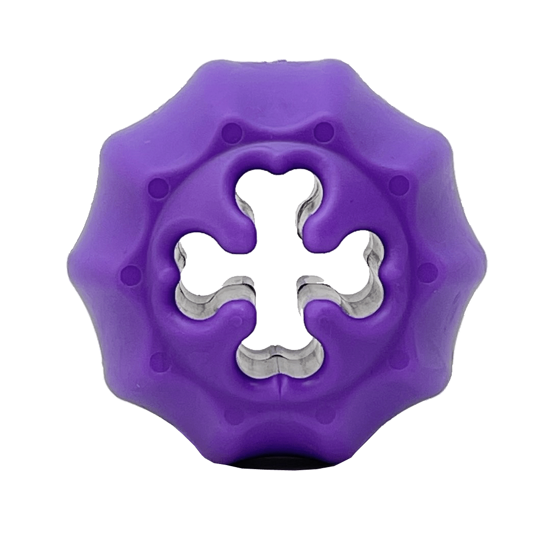 A durable purple Cross Bones Chew Toy and Treat Pocket by SodaPup with a hole in the middle that can also be used as a bully stick holder and dispenses treats.