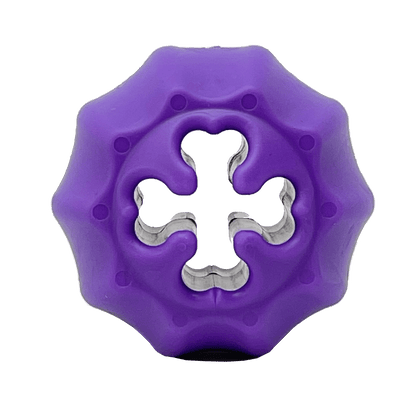 A durable purple Cross Bones Chew Toy and Treat Pocket by SodaPup with a hole in the middle that can also be used as a bully stick holder and dispenses treats.