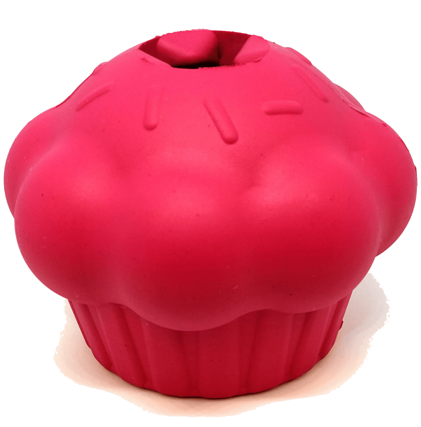 The Cupcake EDispenser Durable Rubber Chew Toy & Treat Dispenser by SodaPup is a bright pink rubber dog toy designed in the shape of a cupcake with sprinkles on top, and it also cleverly dispenses treats.