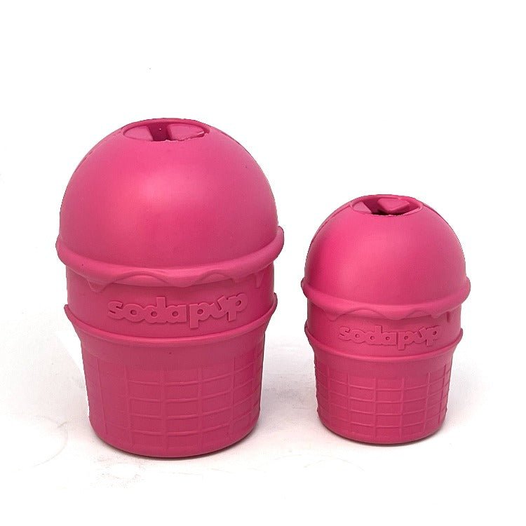 Two SodaPup Ice Cream Cone Durable Rubber Chew Toy and Treat Dispensers sitting next to each other, perfect as a chew toy for dogs.