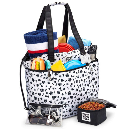 A Mobile Dog Gear Dogssentials Travel Tote bag with various dog essentials.